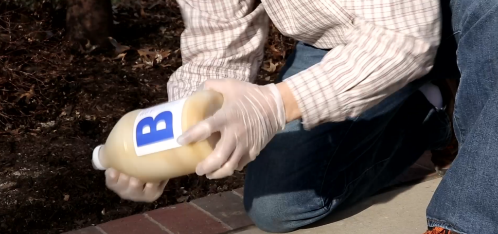 shaking bottle containing the two parts of Postloc to create fence post foam
